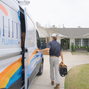 Whitehead technician at a home in Panama City walking to the work van for equipment | Whitehead Plumbing & Air Conditioning HVAC & Plumbing Company serving Bay Conty, Inlet Beach & surrounding areas